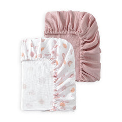 TADO MUSLIN rainbow pattern crib sheet folded, showing soft organic cotton for gentle, breathable sleep.