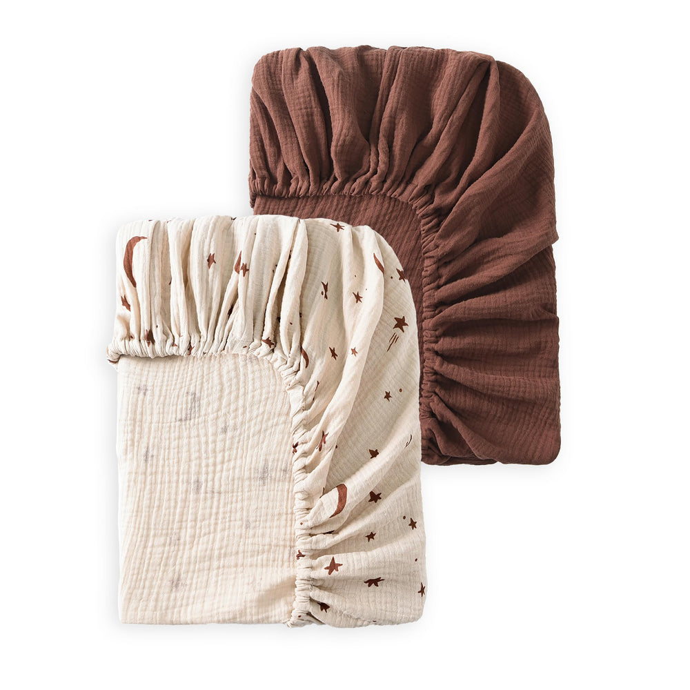 TADO MUSLIN baby crib sheets packaging emphasizes organic softness for peaceful newborn sleep.