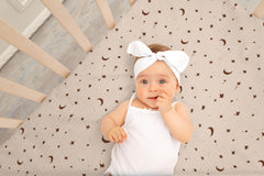 TADO MUSLIN close-up fabric showcases breathable, moisture-wicking muslin ideal for year-round comfort.