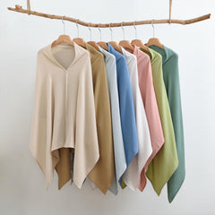 TADO MUSLIN nursing cover used as stroller canopy with sun protection and peek-a-boo opening.