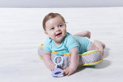 Taf Toys tummy time cushion side view highlights gentle elevation for comfortable play.