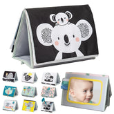 Taf Toys tummy time book cover boosts early visual attention during tummy time.