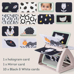 Taf Toys mirror feature inside book invites gaze awareness during play.