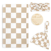 TANOFAR newborn swaddle blanket light brown checkerboard in use for cozy wrapping.