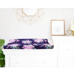 Tanofar purple flower changing pad cover with dinosaur accents highlights playful design for newborns.