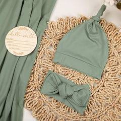 TANOFAR swaddle green headband model demonstrates stretchy fit for secure, cozy wear