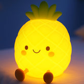 Tarinks Pineapple Night Light on a kid’s dresser delivering a soft bedtime glow.