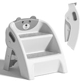 Tavlshero folding toddler step stool folded for compact bathroom storage.