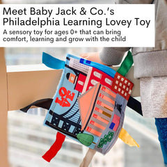 The Learning Lovey USA cities and shapes tag toy encourages sensory discovery.