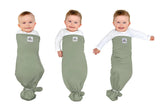 The Ollie Swaddle arms-in setup shows snug adjustable fit for newborn sleep