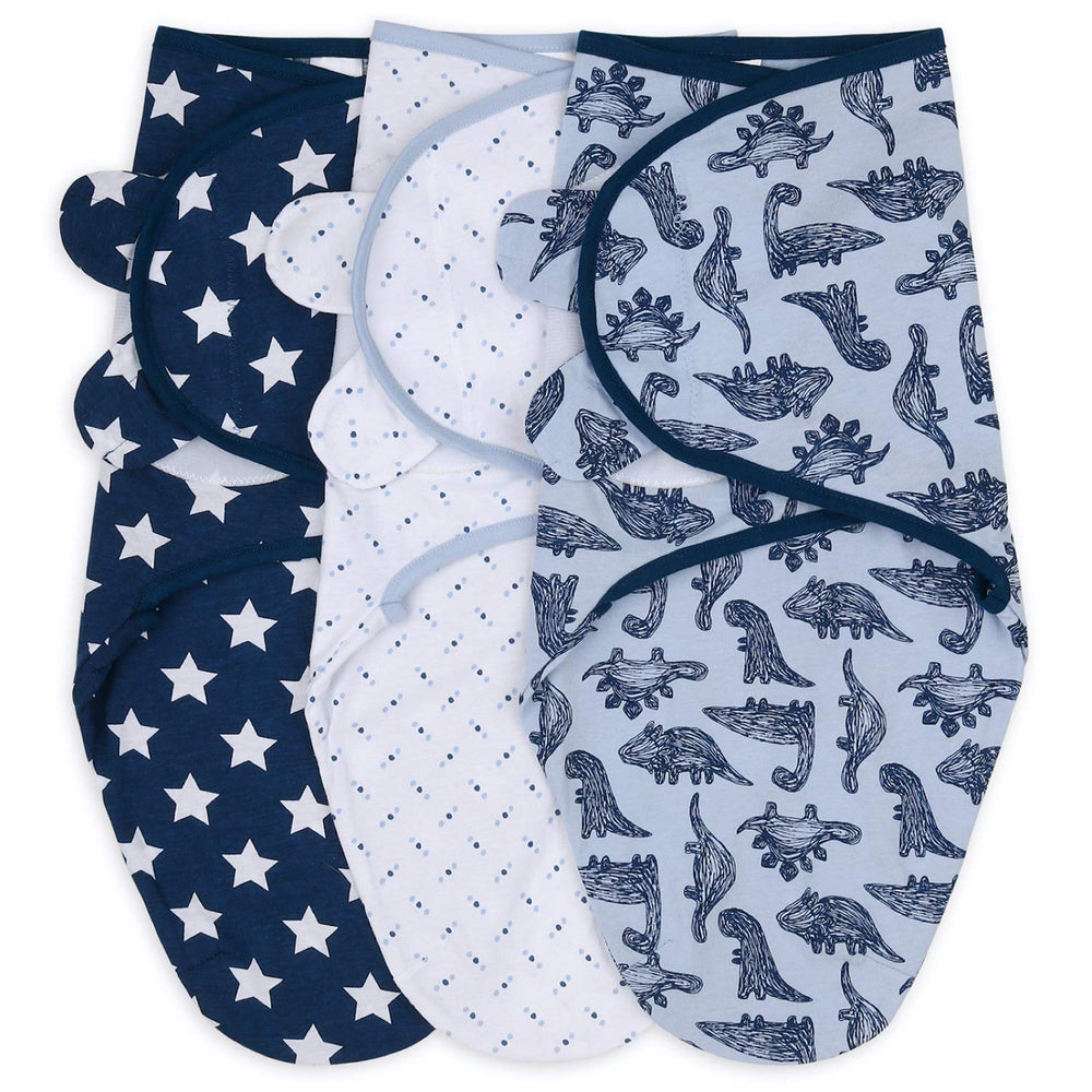 The Peanutshell blue dinosaur swaddle set fabric close-up highlights breathable cotton for comfort.
