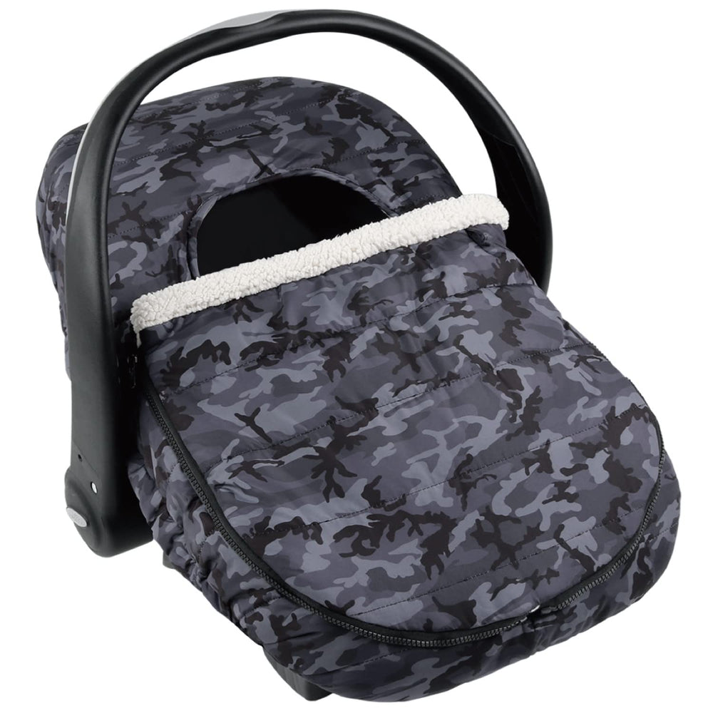 The Peanutshell car seat cover in use providing 360-degree warmth for baby