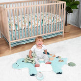 The Peanutshell dinosaur crib sheet closeup adds bright color for a joyful nursery.