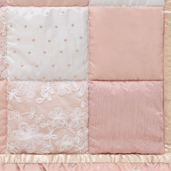 The Peanutshell Grace layered dust ruffle adds depth and a soft floral touch.