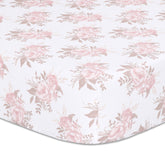 The Peanutshell Grace floral crib sheet in pink prints a soft, breathable surface for cozy naps.