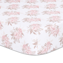The Peanutshell Grace floral crib sheet in pink prints a soft, breathable surface for cozy naps.