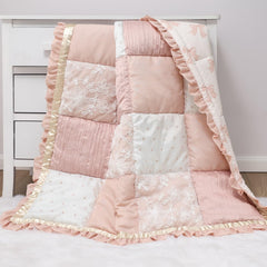 The Peanutshell Grace quilt embroidery details highlight delicate textures and charm.