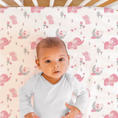 The Peanutshell pink elephant dust ruffle adds coordinated nursery style and coverage.