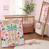 The Peanutshell safari crib bedding set with elephants and giraffes creates a cheerful, kid-friendly nursery ambiance.
