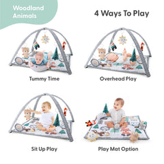 The Peanutshell Woodland bear toy on the play gym supports grasping and exploration.