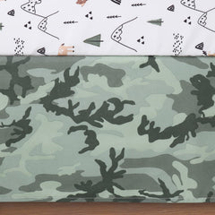 The Peanutshell woodland camo nursery setup showcases coordinated bedding for a playful room.