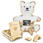 The Real Bossy Baby teddy bear frame showing a memory-keeping guest book alternative in a nursery setting.
