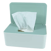 The Revenant diaper wipes dispenser with green lid; compact, accessible for quick changes.