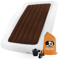 The Shrunks toddler travel bed setup shows a cozy, travel-ready sleep space.