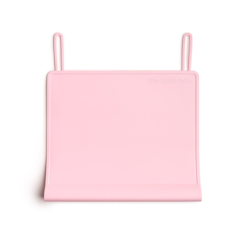 The Table Tyke Ballet Pink placemat edge bumper protects your child's gums from table edges during meals.