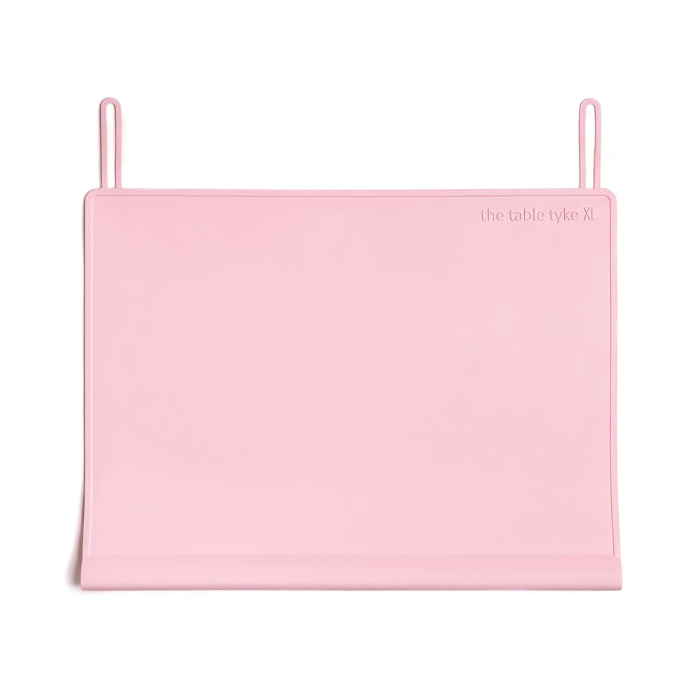 The Table Tyke Placemat XL teething-edge bumper cushions little mouths at mealtime.