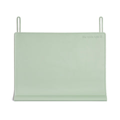 The Table Tyke XL placemat in sage green with teething edge cushions little mouths during meals.
