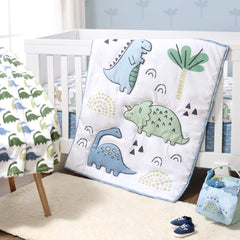 The Peanutshell blue dino quilt offers cozy bedtime comfort for baby naps.