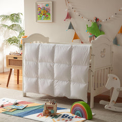 Three Geese toddler comforter duvet attachment tabs show easy cover changes.