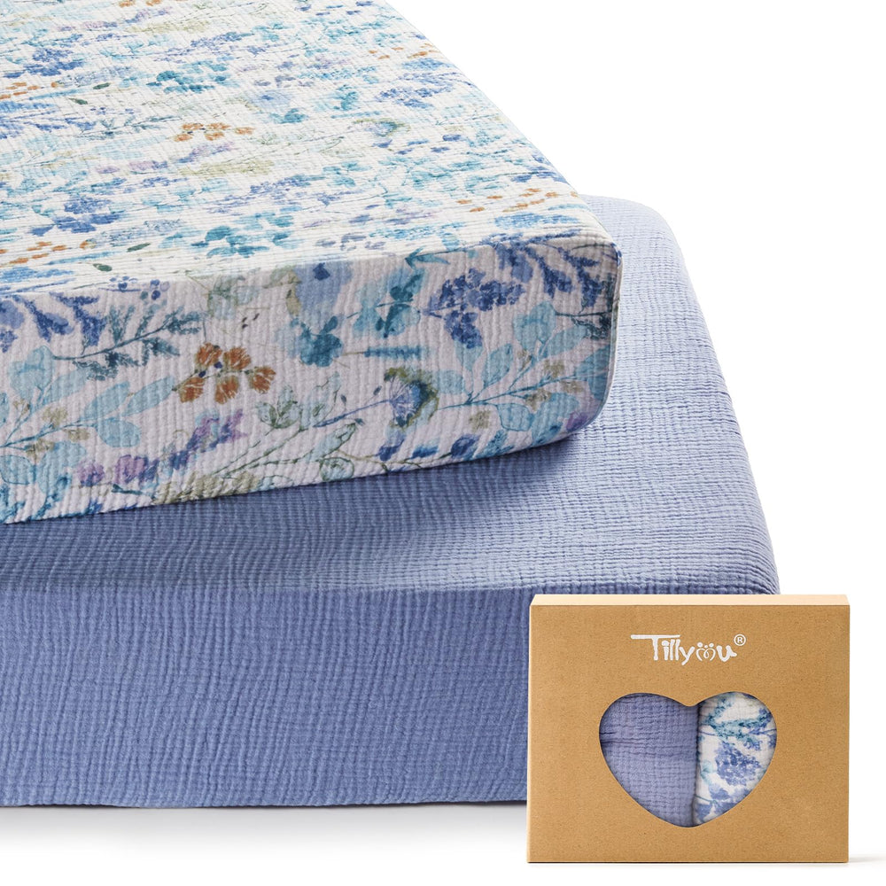 TILLYOU 2-pack muslin crib sheets blue flower close-up, breathable cotton for baby comfort.