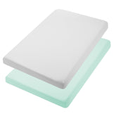 TILLYOU mini crib sheet in light green, neatly folded for quick use and cozy baby comfort.