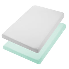 TILLYOU mini crib sheet in light green, neatly folded for quick use and cozy baby comfort.