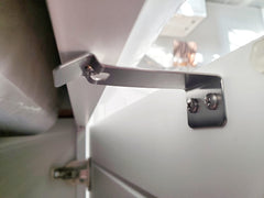 Tin Soldier latch drawer installed secures storage without visible hardware.