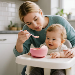 Tiny Tastes baby bib with food catcher helps keep clothes clean during solids.