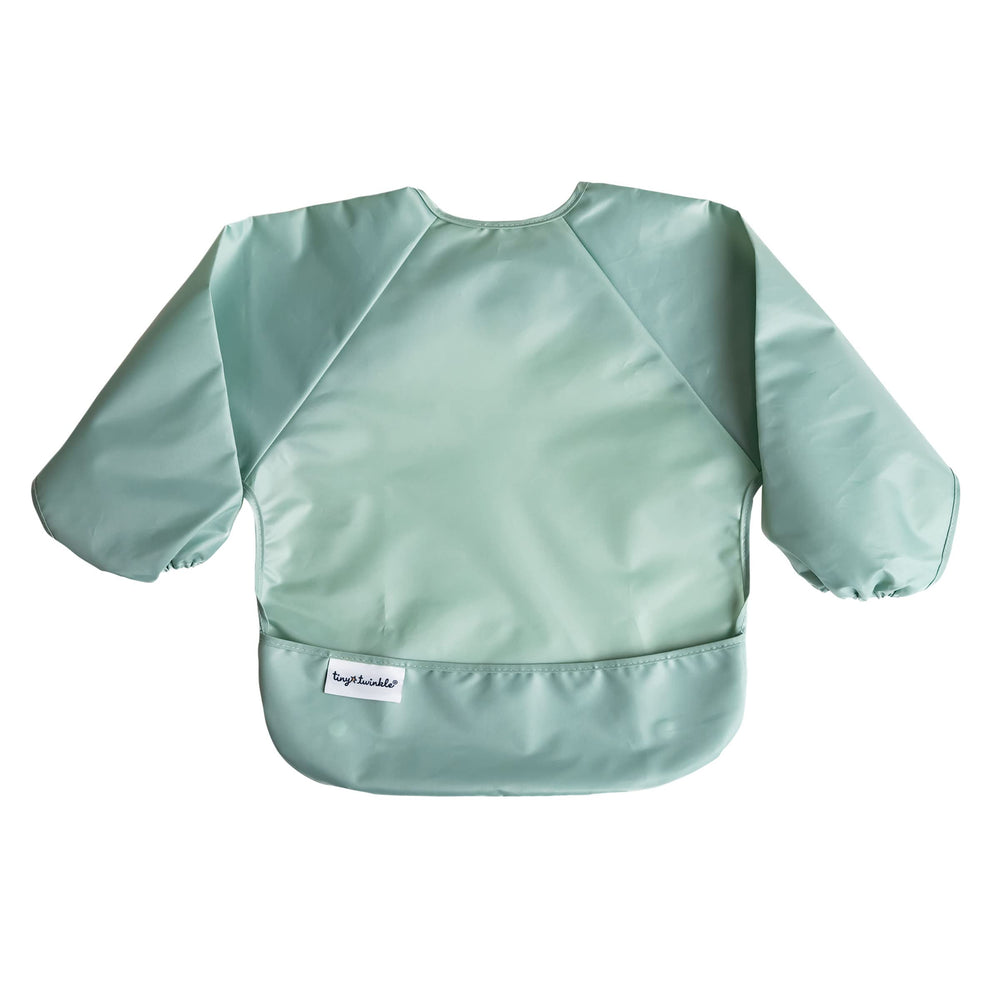 Tiny Twinkle long sleeve bib in sage green for full-coverage mealtime mess control.
