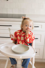 Tiny Twinkle long sleeve bib wiped clean after meals.