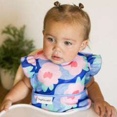 Tiny Twinkle mess-proof bib floral blue close-up fabric showing soft finish for delicate skin