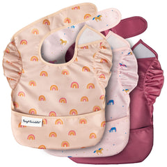 Tiny Twinkle mess-proof bib unicorn catch-pocket for mess containment during meals.