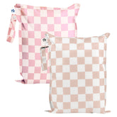 Tiny Twinkle Mess-Proof Wet Bag pink-brown-checkers folded neatly in a stroller for travel