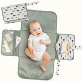 Tiny Twinkle portable changing pad folds flat for compact travel storage.