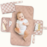 Tiny Twinkle portable changing pad folded-flat 7x10 inches for easy on-the-go diaper changes.