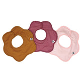 Tiny Twinkle Roundabout Drool Bib on baby wearing cinnamon set, cozy coverage for teething mess