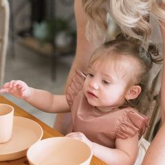 Tiny Twinkle waterproof bib during mealtime keeps clothes clean and dry
