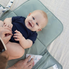 Tiny Twinkle waterproof changing pad keeps surfaces clean and dry for baby comfort.
