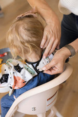 Tiny Twinkle waterproof smock back coverage illustrates full-body protection during feeding