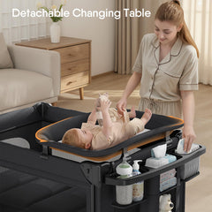 TinyGlow bedside-crib closeup highlights safe wrap-around design for diaper changes.